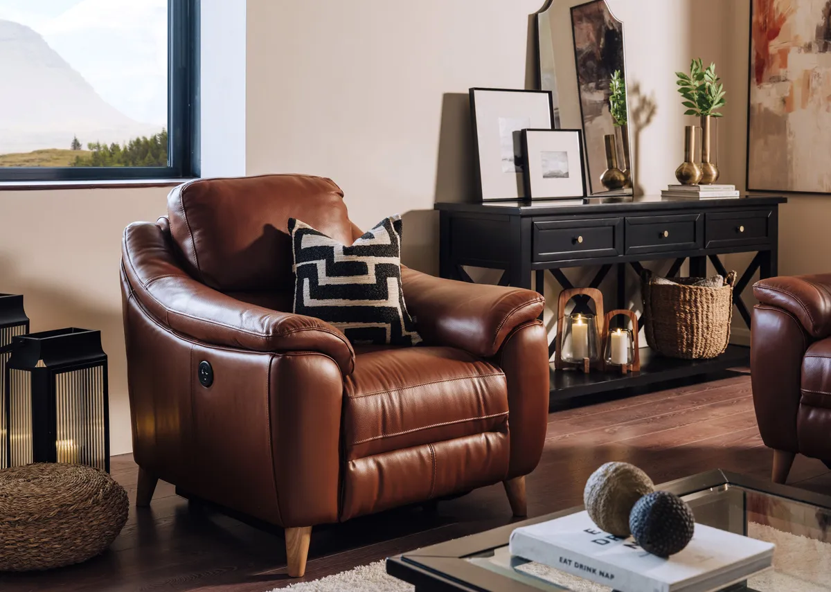 A lifestyle image of the Blaze armchair with Hampton black tables.