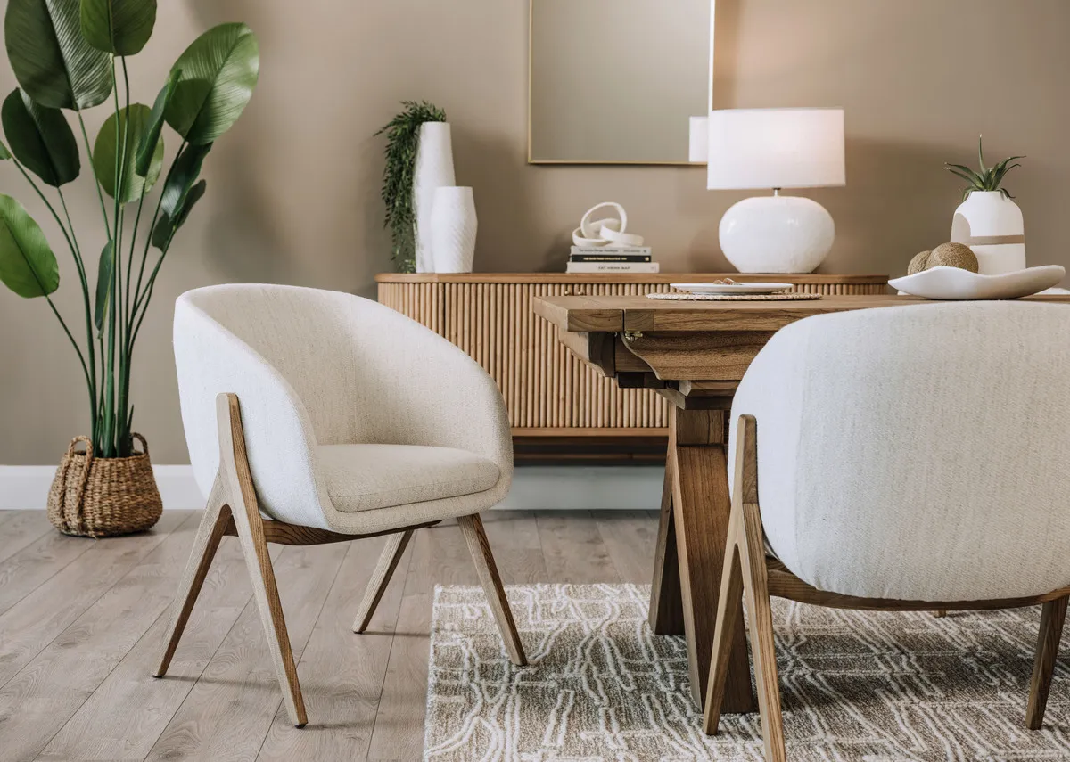 A lifestyle image of the Toulon dining chair with dining tabe and sideboard
