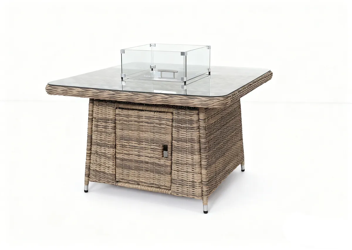 A beige corner garden sofa with 2 ottomans and a glass top rising table. Closeup of the table with glass top firepit.