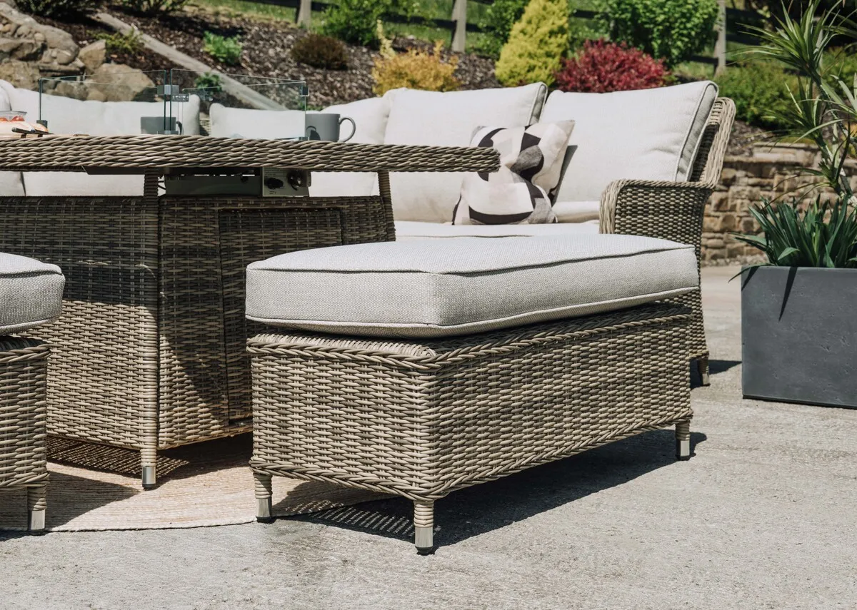 A lifestyle image of the Ottoman with the Monterey garden set.