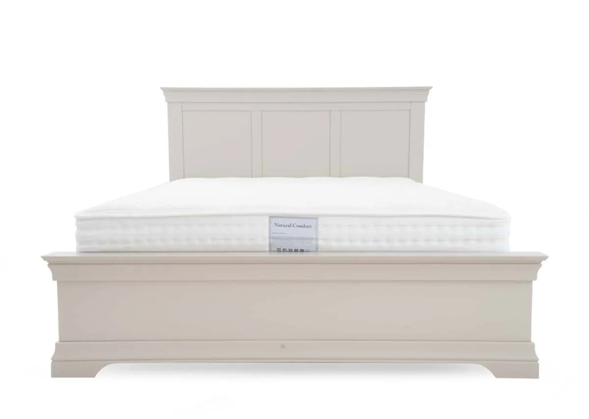 A taupe grey 5ft bed from EZ Livings Dove range. View of panelled footboard and high panelled headboard.