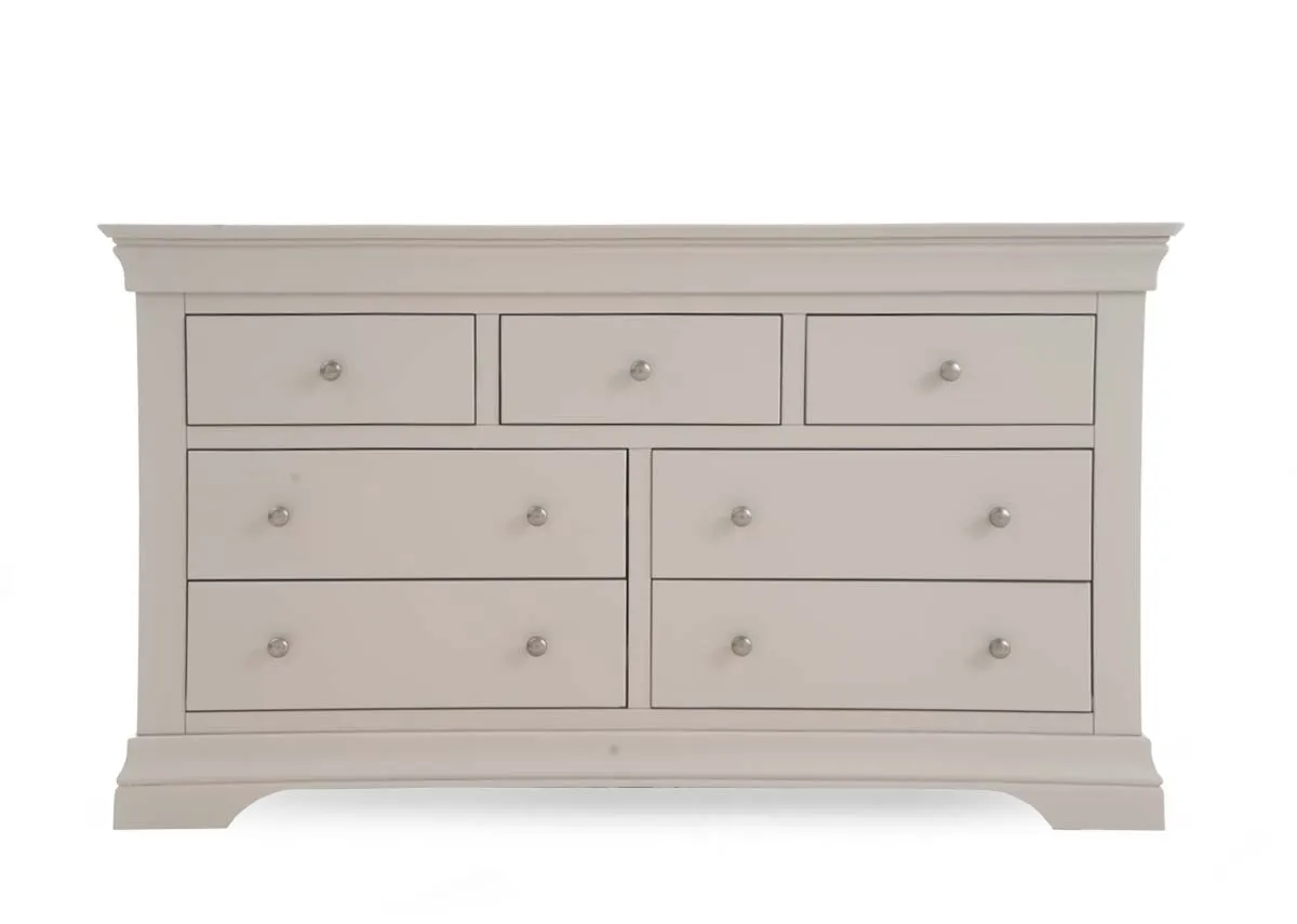 A 7 drawer taupe dresser from EZ Livings Dove range.Front view of detailed carving on legs
