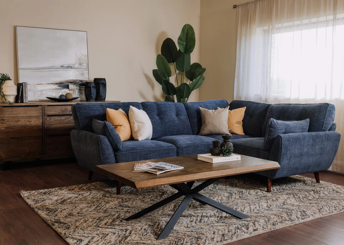 A lifestyle image of the Caoimhe Corner sofa with the arno coffee table and sideboard with Savannah rug.