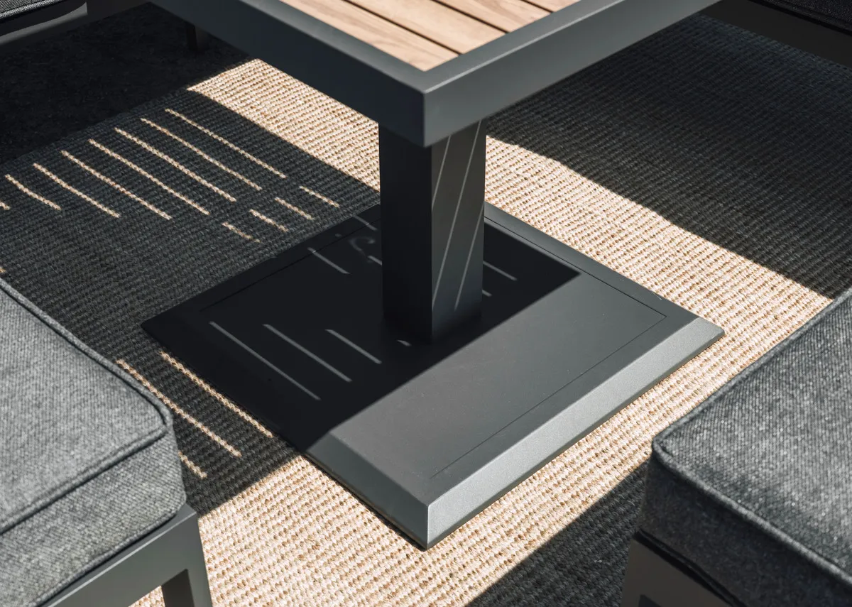 A grey garden dining table with a ceramic top from EZ Livings Soho range. Angled view