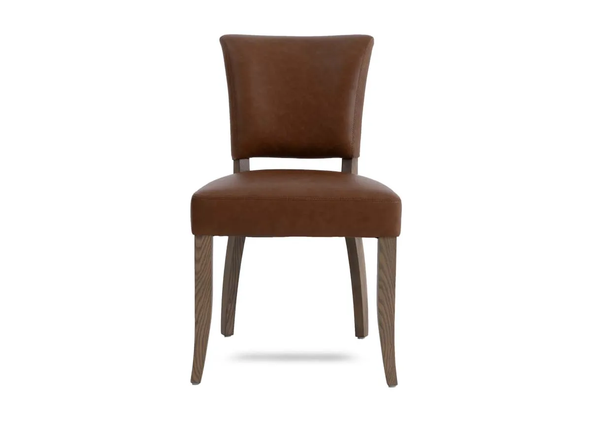 A tan leather dining chair from EZ Livings Geneva range. Front view of padded seat.
