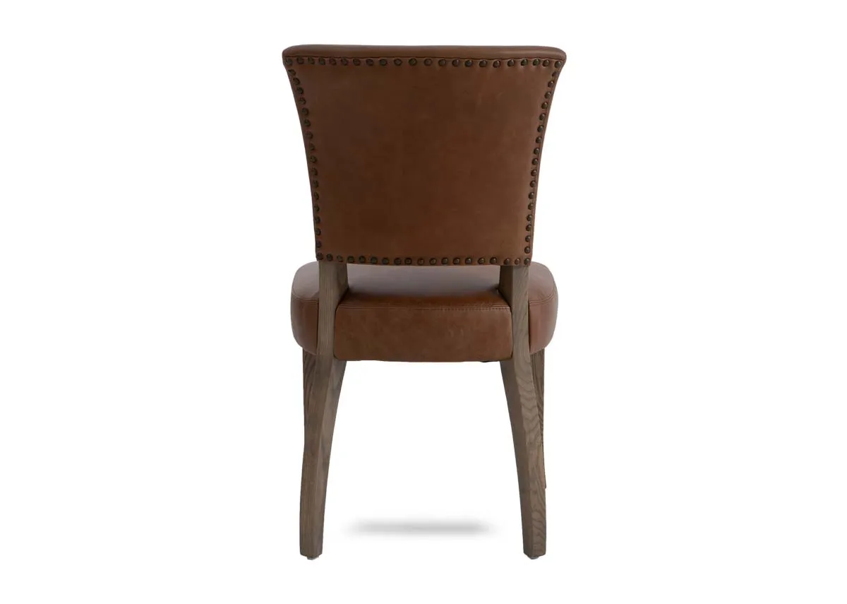 A tan leather dining chair from EZ Livings Geneva range. Back view of stud detail on seat