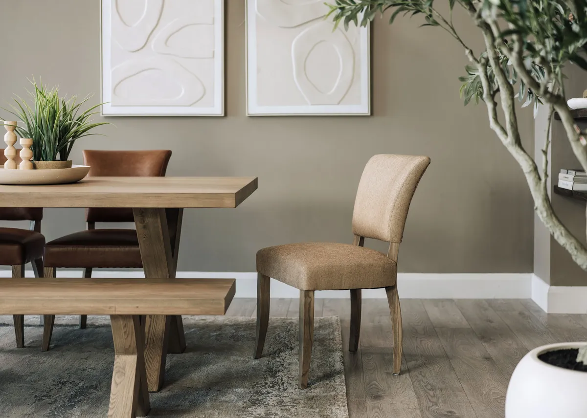 A lifestyle image of the Geneva dining chair with dining table and Gateway pictures.
