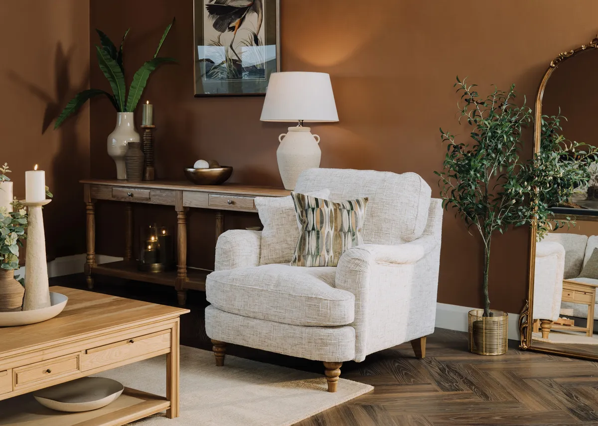 A lifestyle image of the Lismore armchair with Obessa cushion