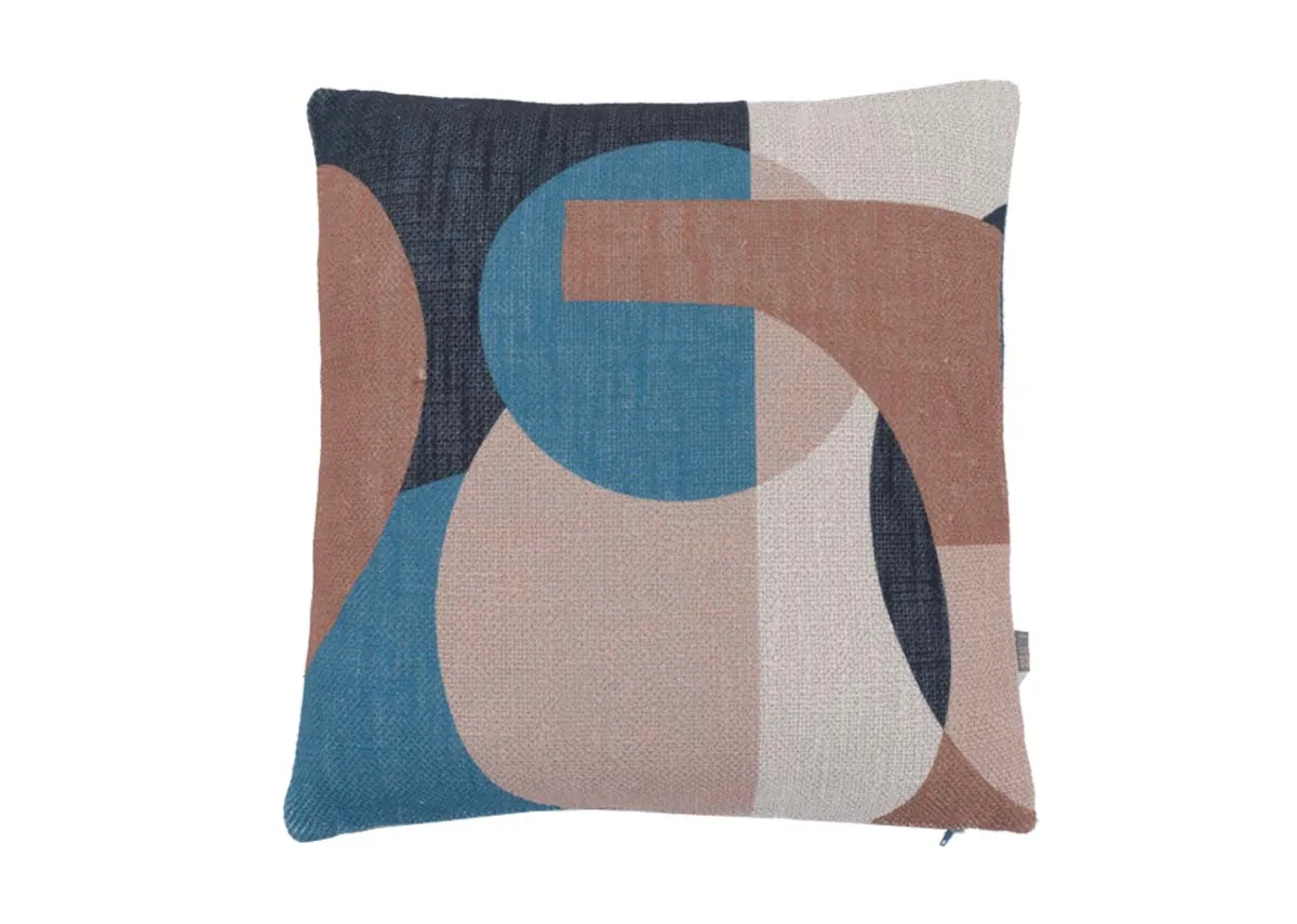 A blue geo print cushion with terracotta and pink shapes. Front view.