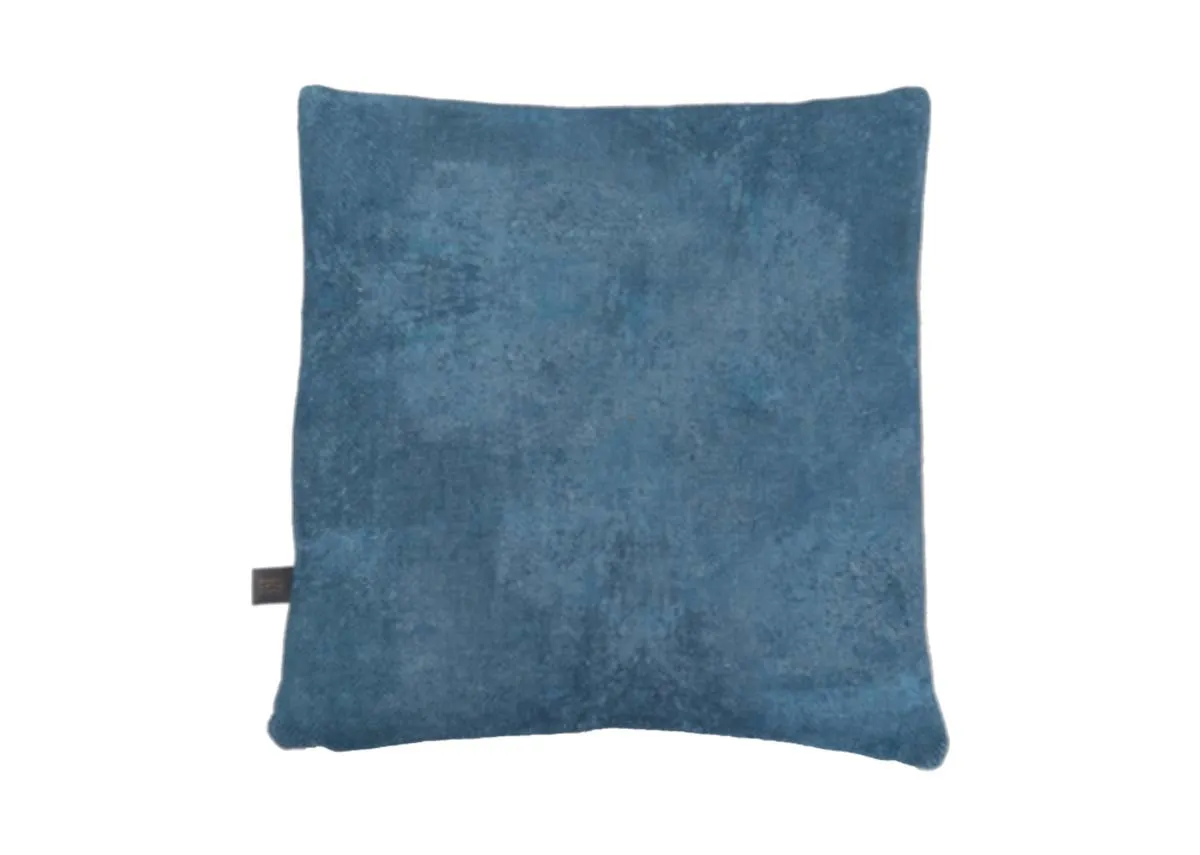 A blue geo print cushion with terracotta and pink shapesBack view shows plain all blue
