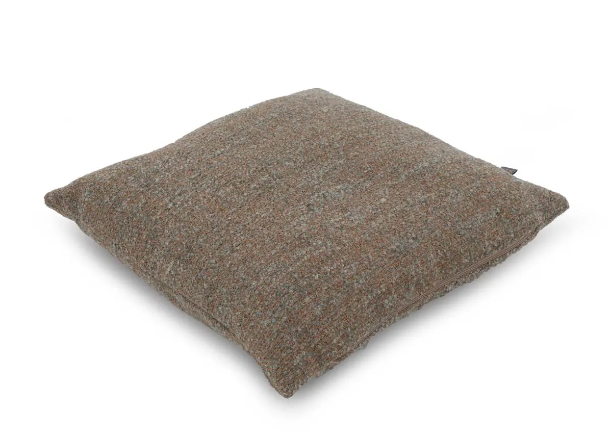 A copper green fabric cushion from EZ Livings Zari range. Angled view