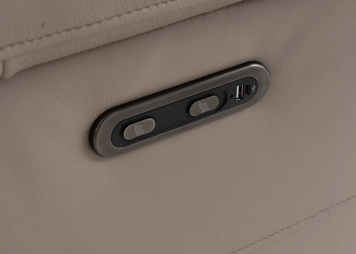 A beige leather recliner from EZ Livings Raven range.Closeup of usb port and reclining fucntions.