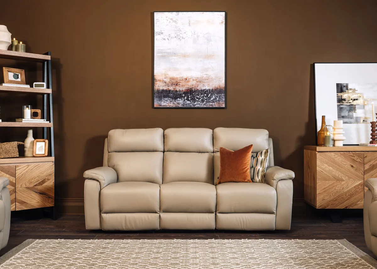 A 3 seater leather power reclining sofa from EZ Livings Raven range. Side view of sofa reclined