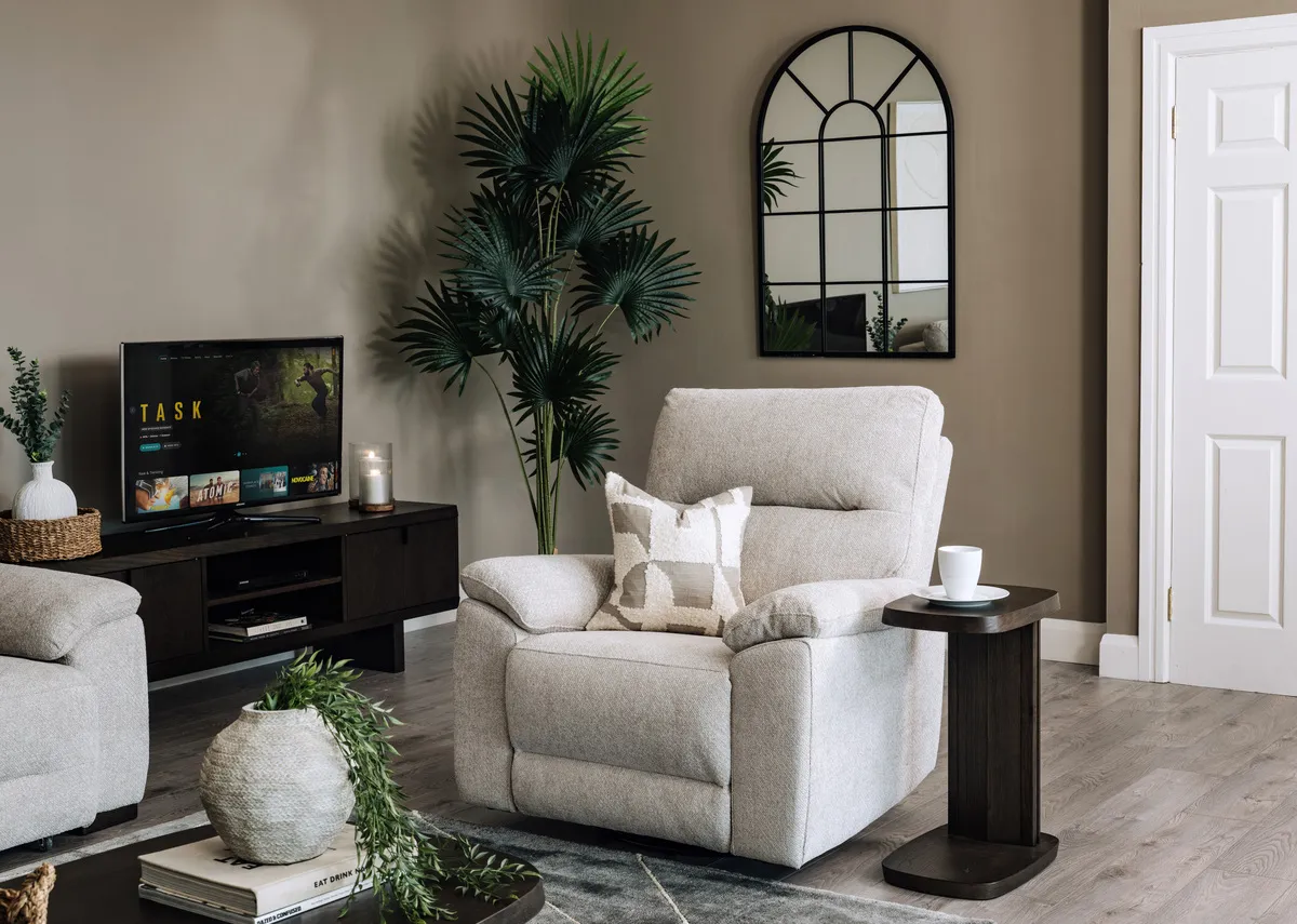 A lifestyle image of the Annalee recliner with Rimini side table and tv unit.