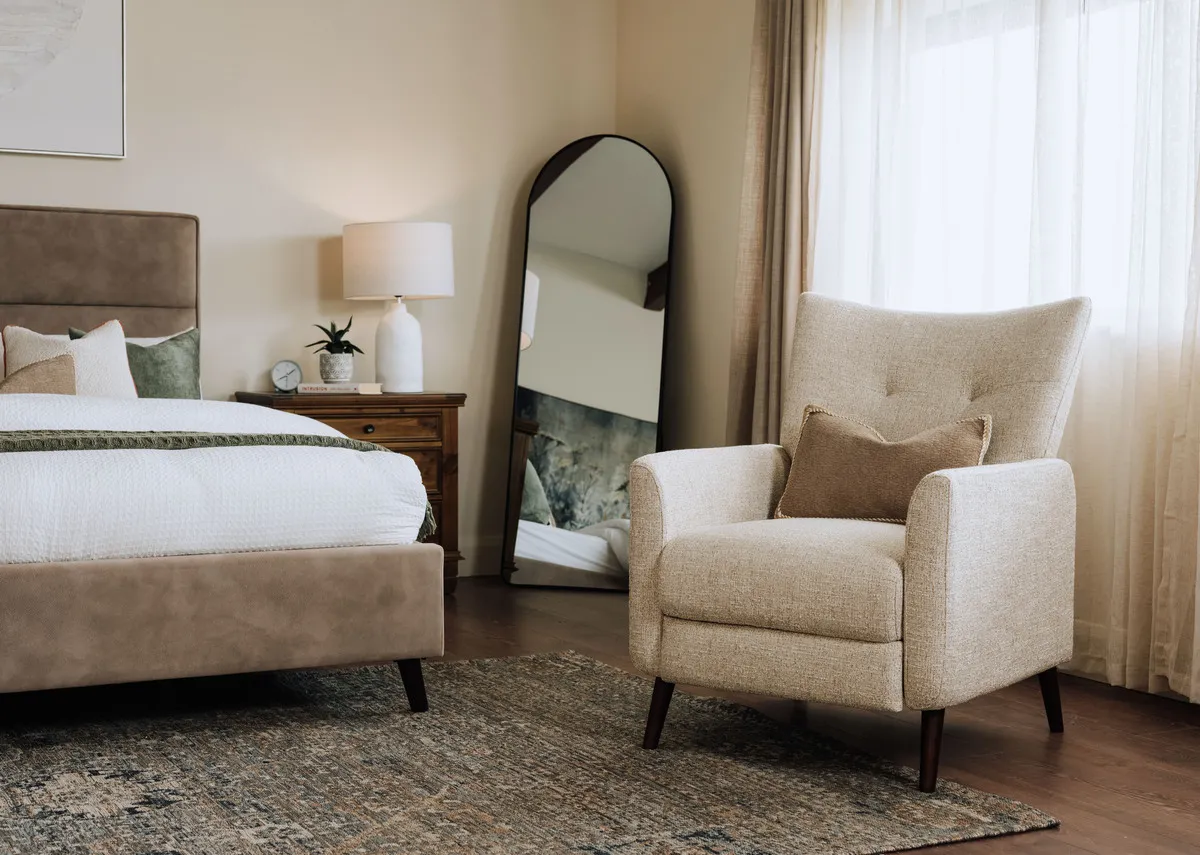 A cream fabric armchair from EZ Livings Ivy range. Closeup of chic fabric