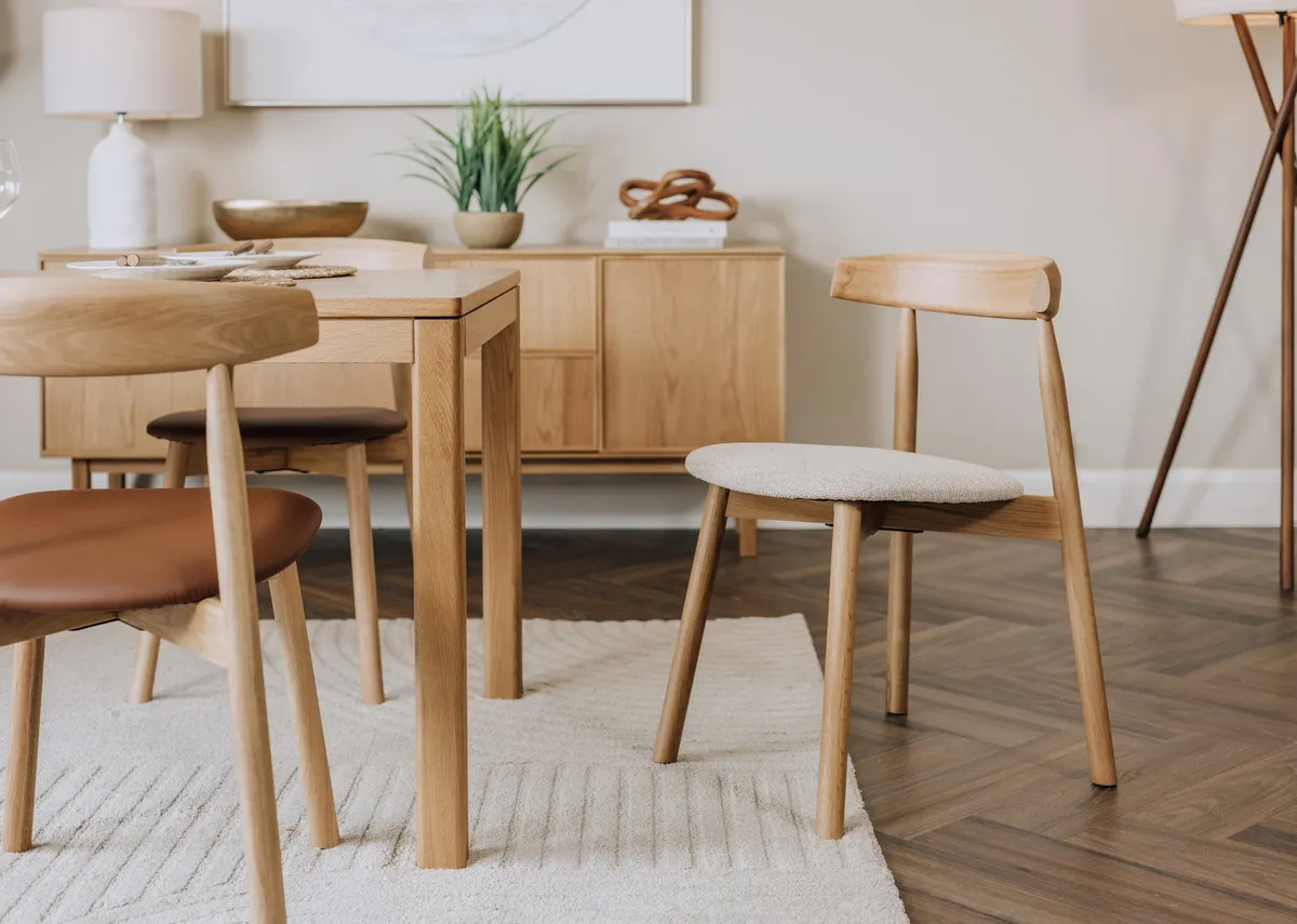 A lifestyle image of the Suri dining chair with Kari dining table