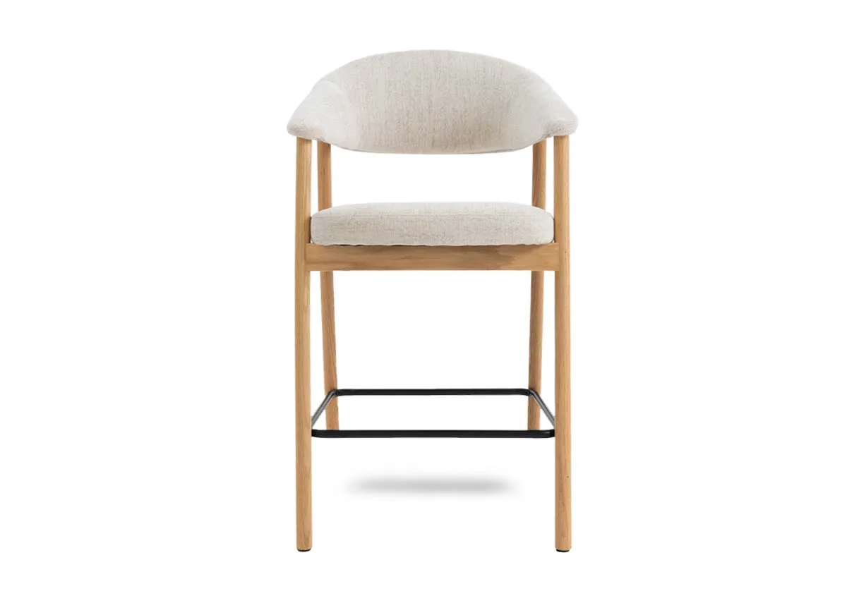A natural oak  framed counter stool with cream fabric backrest and padded seat from EZ Livings Elk range.Front view shows arched seat back