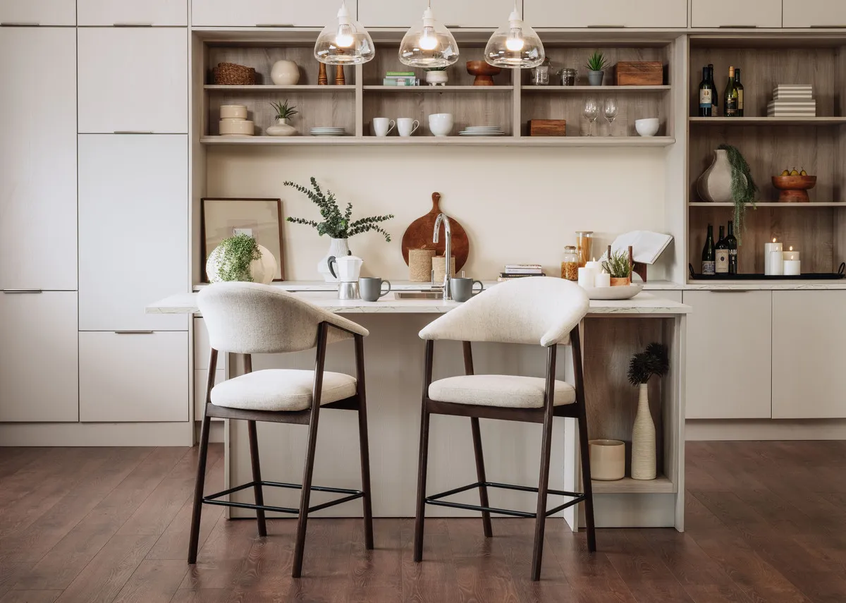 A lifestyle image of two Elk brown counter stools in a kitchen setting at an island.