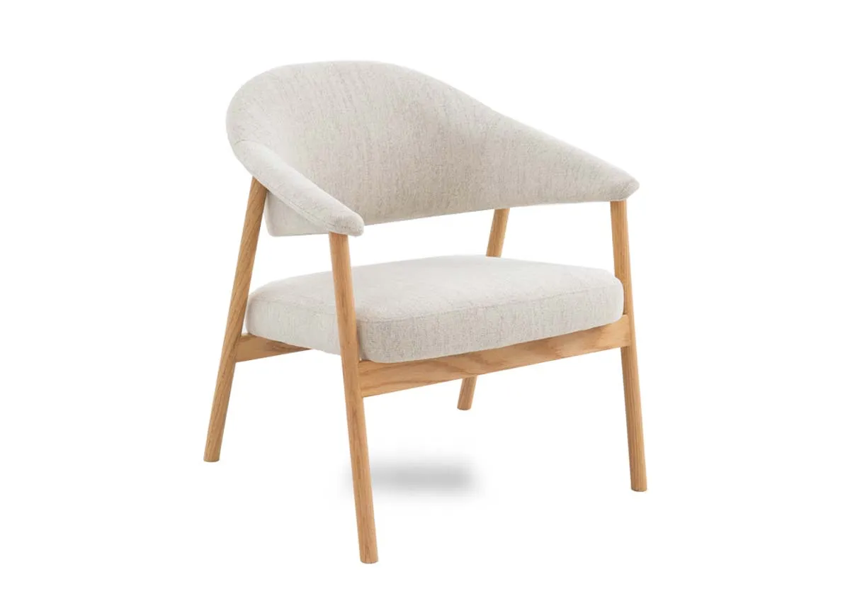 A natural oak lounge chair from EZ Livings Elk range. Angled view.