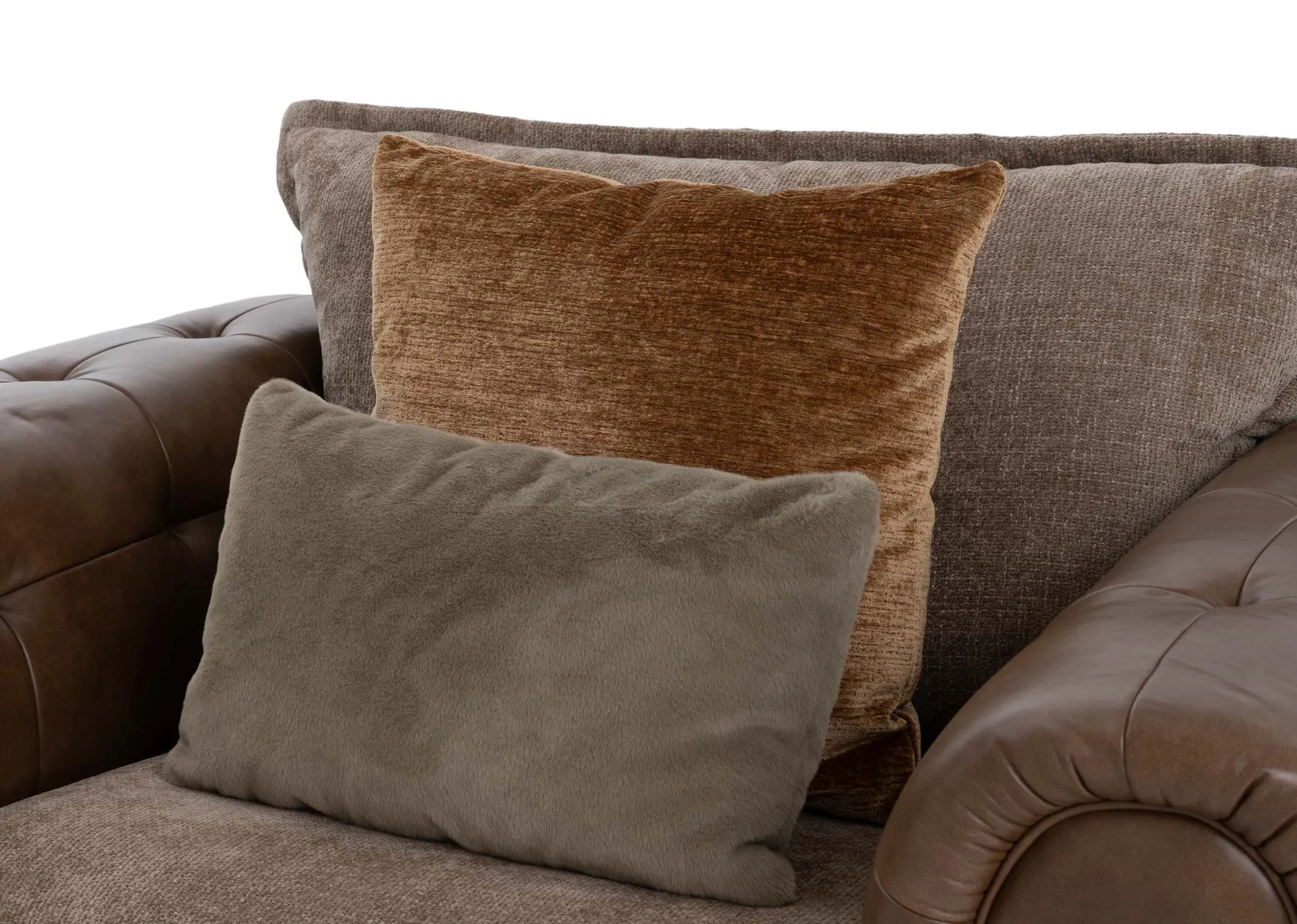A brown cuddler with leather chesterfield frame and beige fabric seat and back cushion from EZ Livings Nepal range.Closeup of leather and fabric contrast