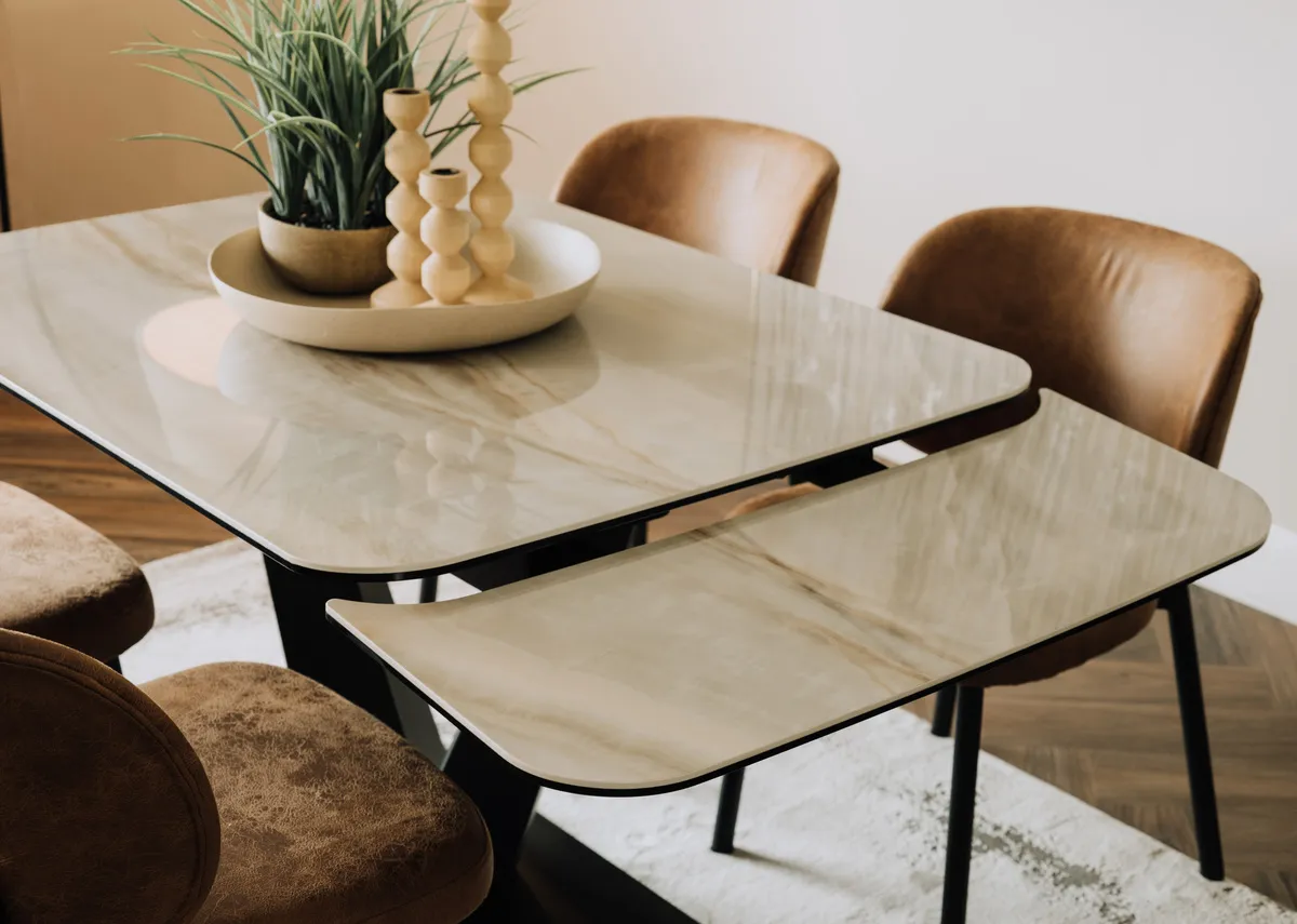 A lifestyle image of the Tuscan table with a closeup of the leaf