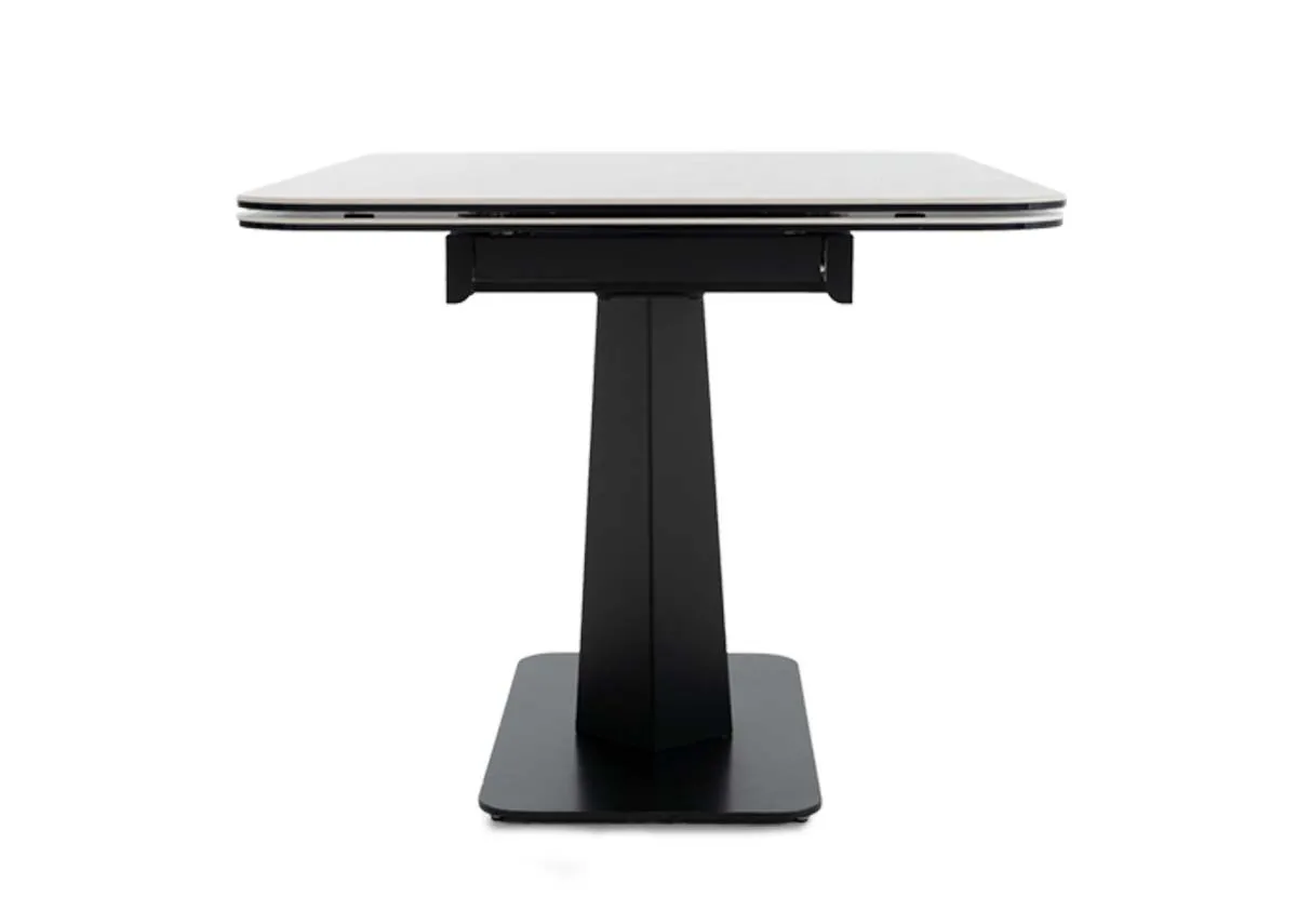 An off white ceramic top dining table from EZ Livings Tuscan range.Table side view