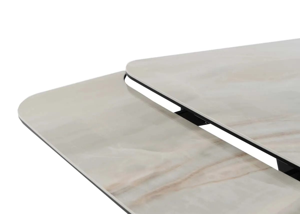 An off white ceramaic top dining table from EZ Livings Tuscan range. Closeup of the extension leaf