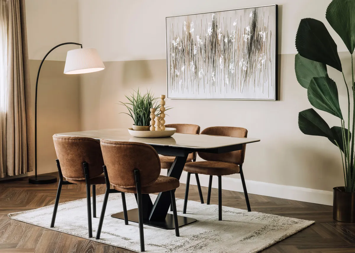 A lifestyle image of the Tuscan table with swan tan chairs and Tones of Grey.
