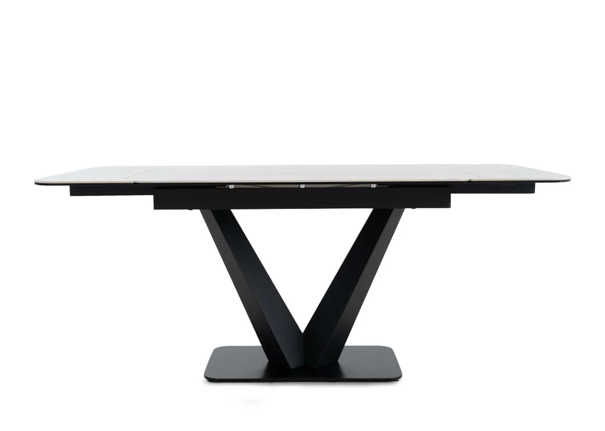 An off white ceramic top dining table from EZ Livings Tuscan range.Table extended
