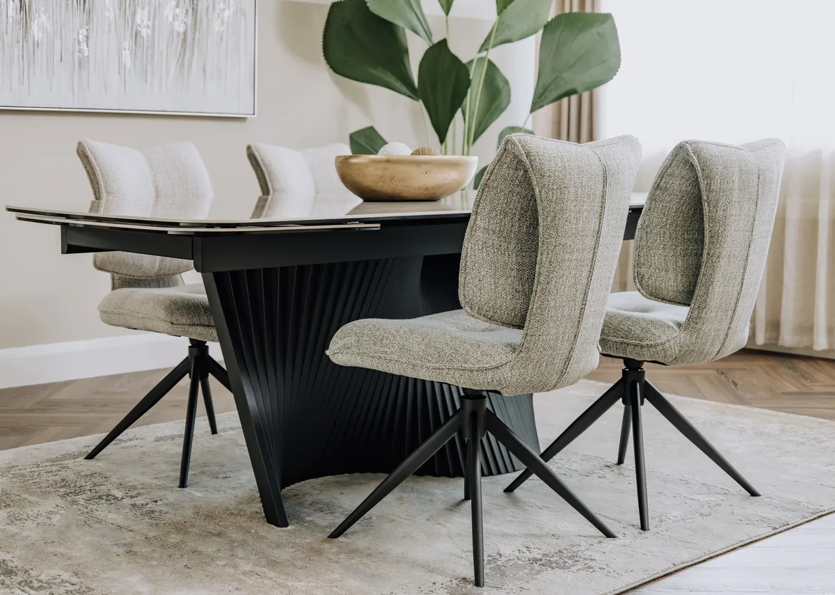 A lifestyle image of the Napoli wheat & green swivel chairs with Napoli table.