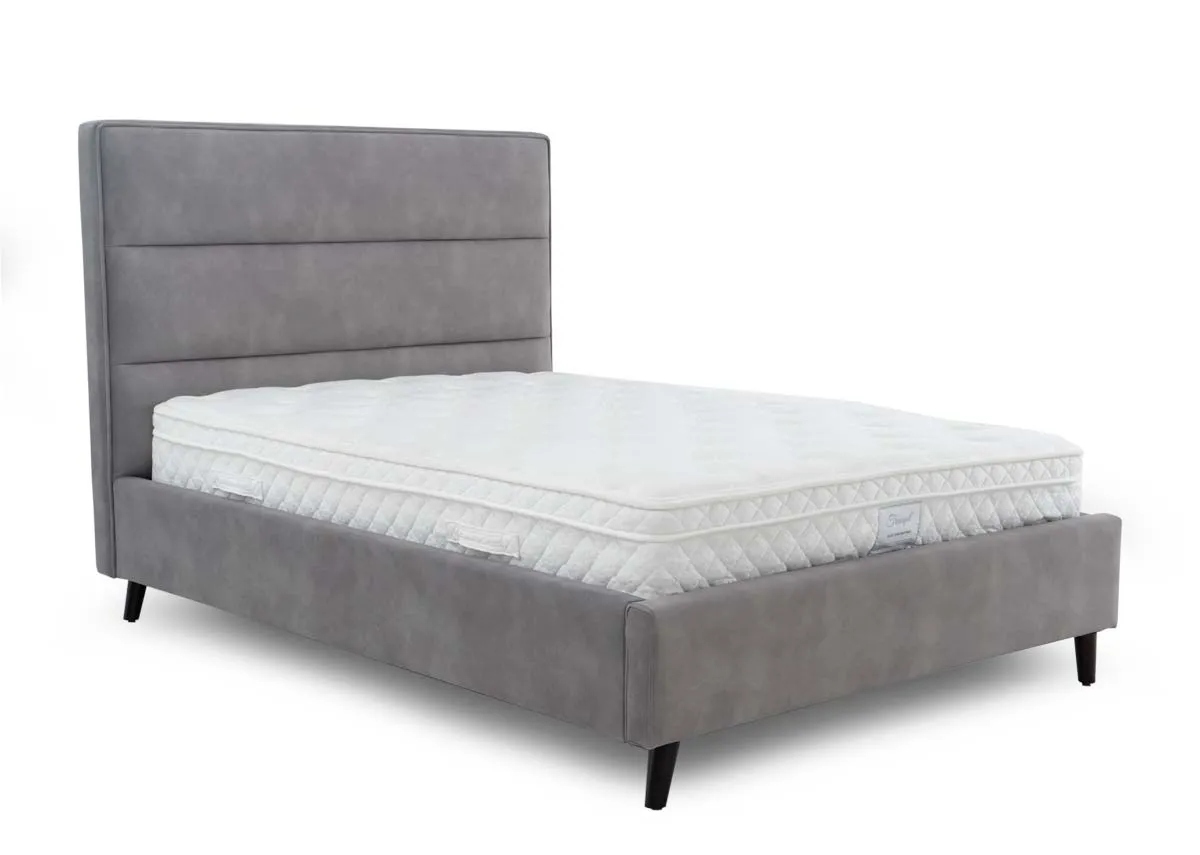 A light grey fabric bedframe from EZ Living Furniture. Angled view of bed with mattress not included.