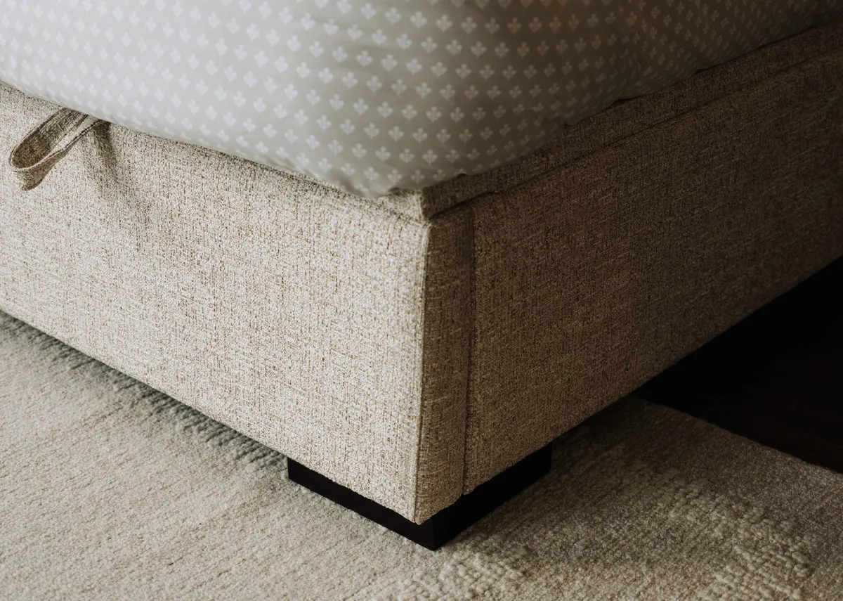 A beige fabric ottoman bed from EZ Livings Liberty range. Front view of bed with mattress not included