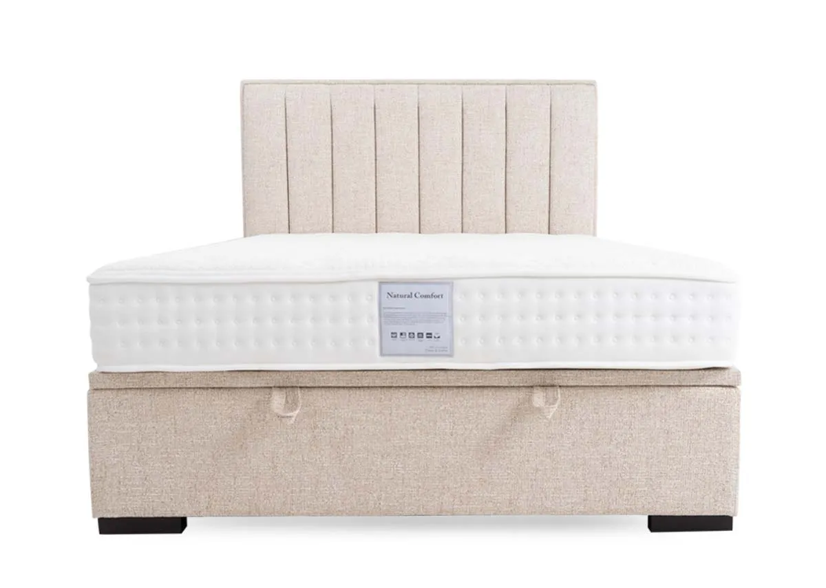 A beige fabric ottoman bed from EZ Livings Liberty range. Closeup of black bed base over frame