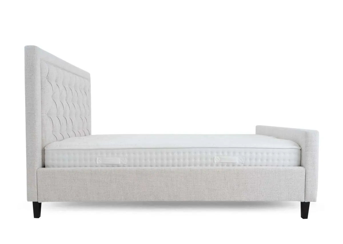 A 4ft6 double bedframe with high tufted head and footboard from EZ Livings Majestic range. Side view of bed with mattress not included.