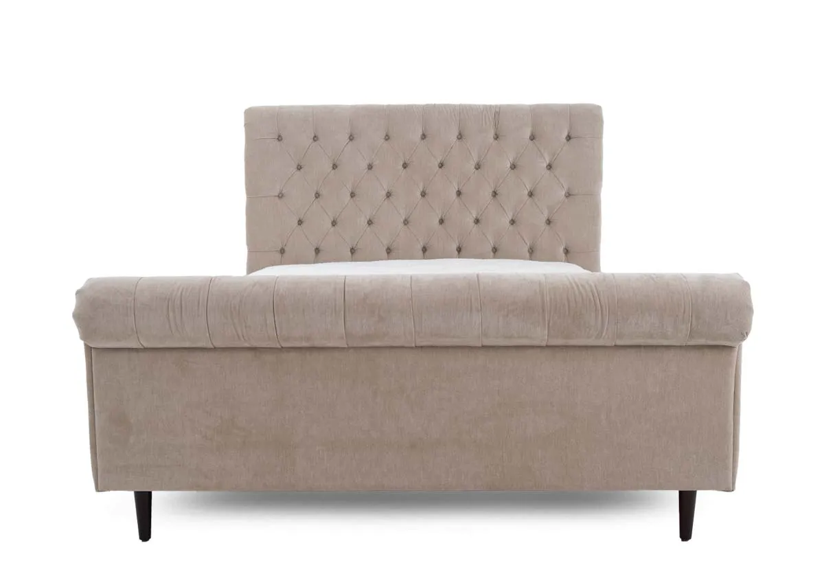 A double bed in taupe grey with button back detail from EZ Livings Sofia range. Front view