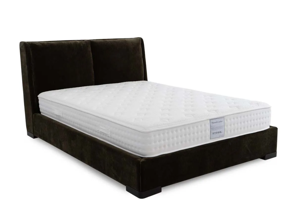 A green fabric bedframe with padded headboard from EZ Livings Comfy range. Angled view of bed with mattress not included