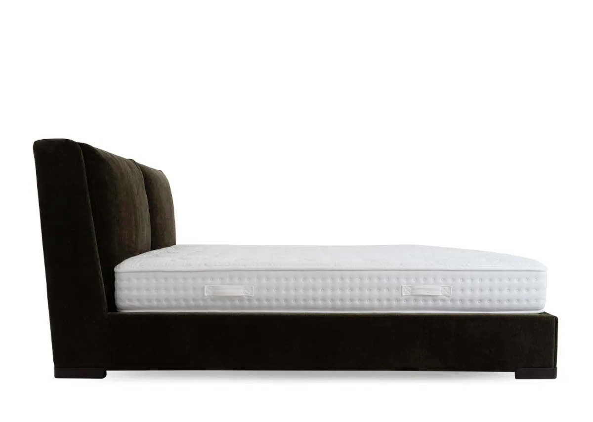 A green velvet fabric bedframe from EZ Livings Comfy range. Side view of upholstered frame.