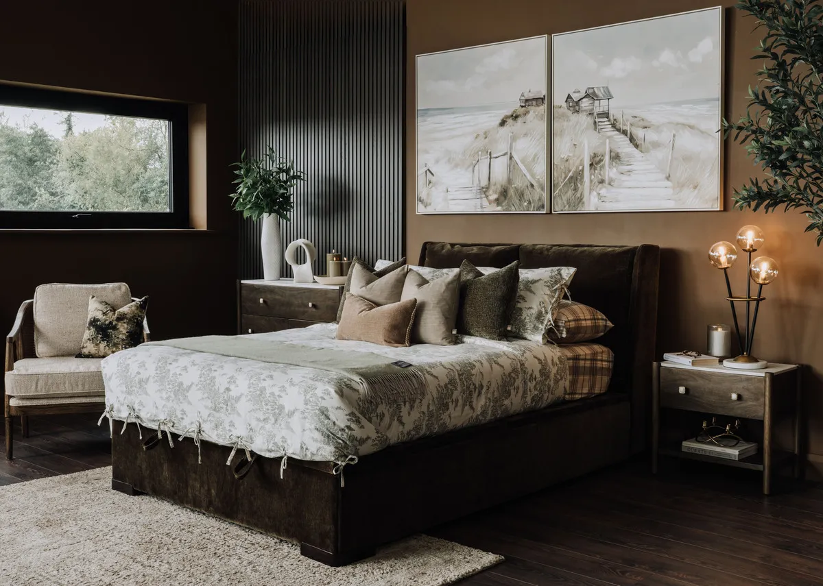 A lifestyle image of the Comfy ottoman open open with nora locker and Eve toile duvet set