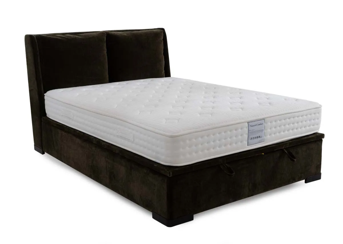 A green fabric ottoman bed with mattres from EZ Livings Comfy range. Angled view of padded headboard.