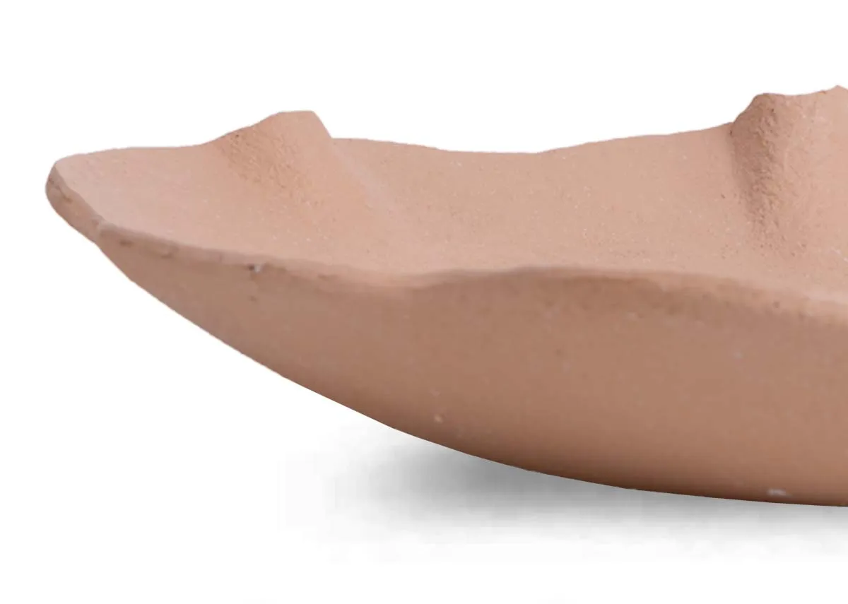 A peach decor bowl from EZ Livings Peony range. Closeup of terracotta finish