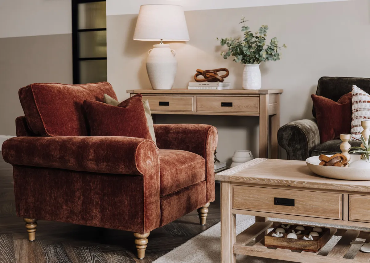 A lifestyle image of the Cotswold armchair with the Albany coffee table and console with