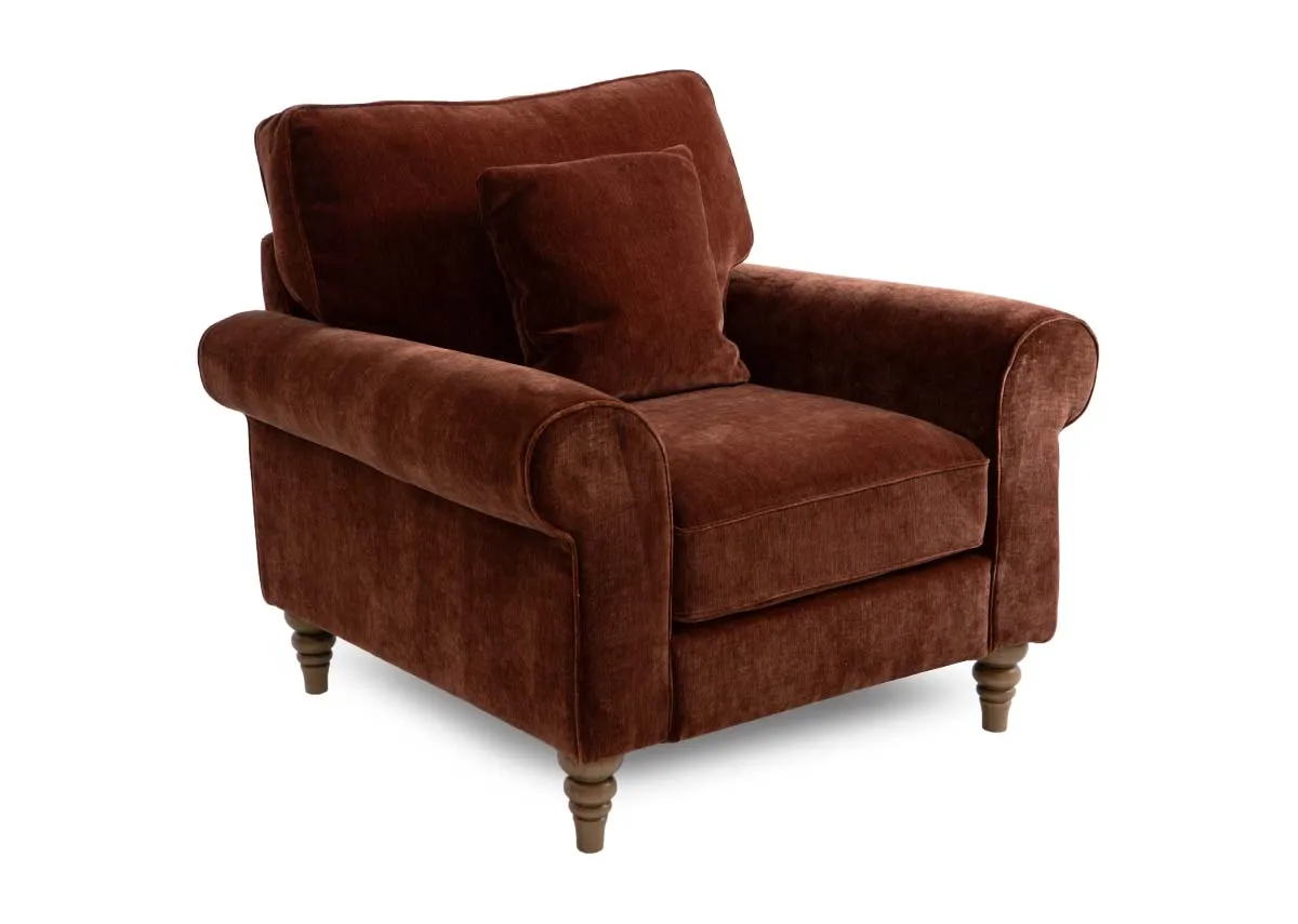 A rust fabric armchair from EZ Livings Cotswold range. Angled view of rust fabric armchair.