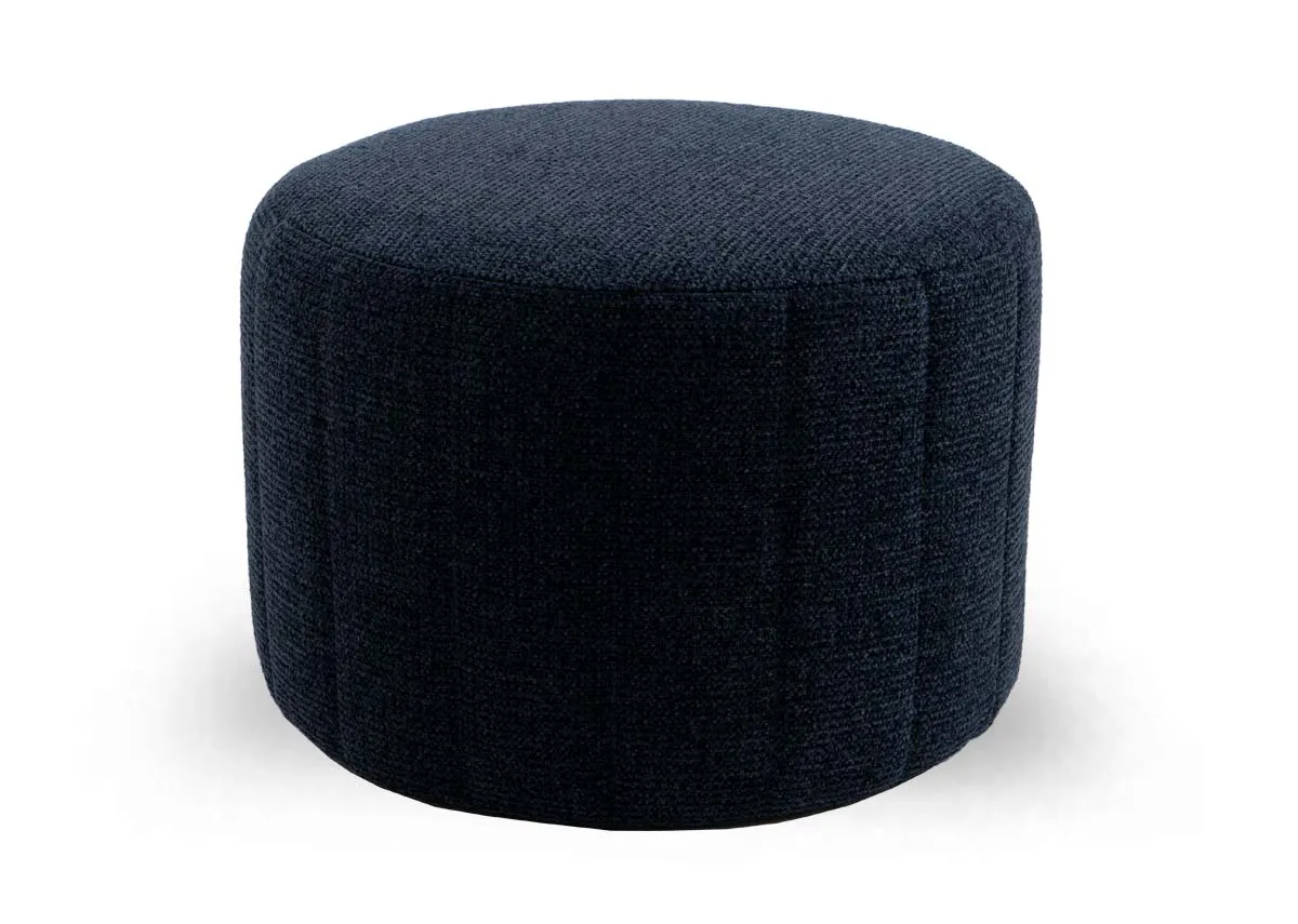 A round navy fabric footstool from EZ Livings Alexo range. Angled view of stitching.