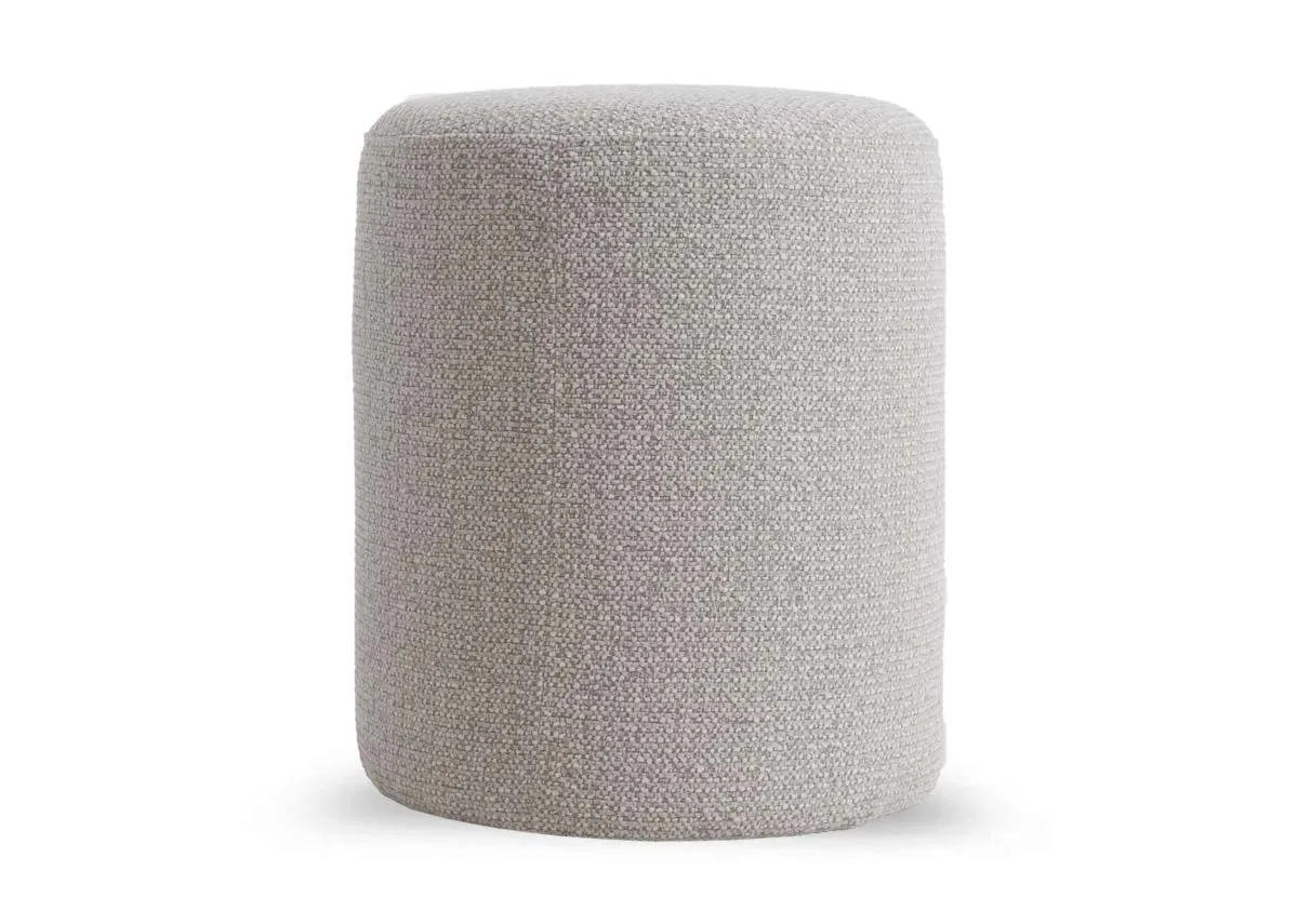 A cylindrical light grey fabric footstool from EZ Livings Parker range. Front view