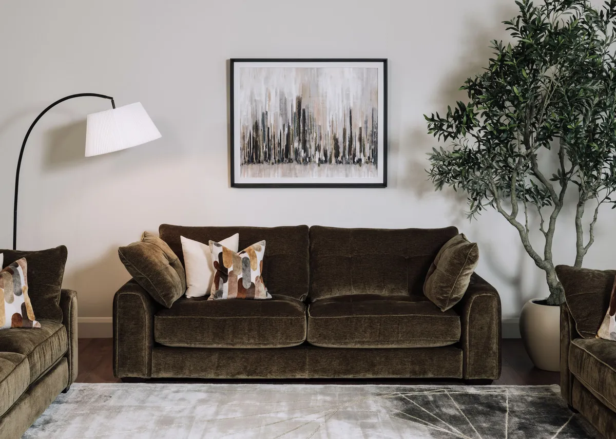 A lifetsyle image of the Darcy 2.5 seater sofa with Urban Silence picture.