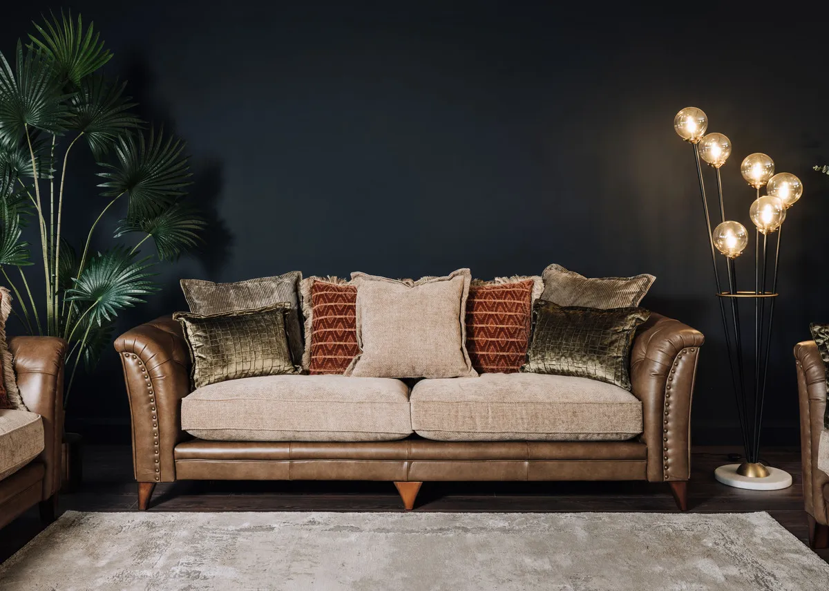 A lifestyle image of Savannah sofa with Ortez lamp.