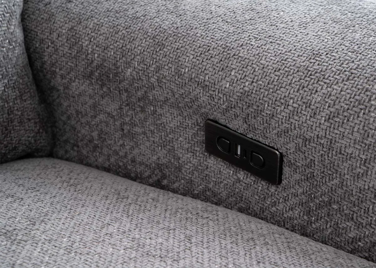 A grey fabric corner sofa from EZ Livings Ashbrook range. Closeup of power and usb port on the armrest on both ends.