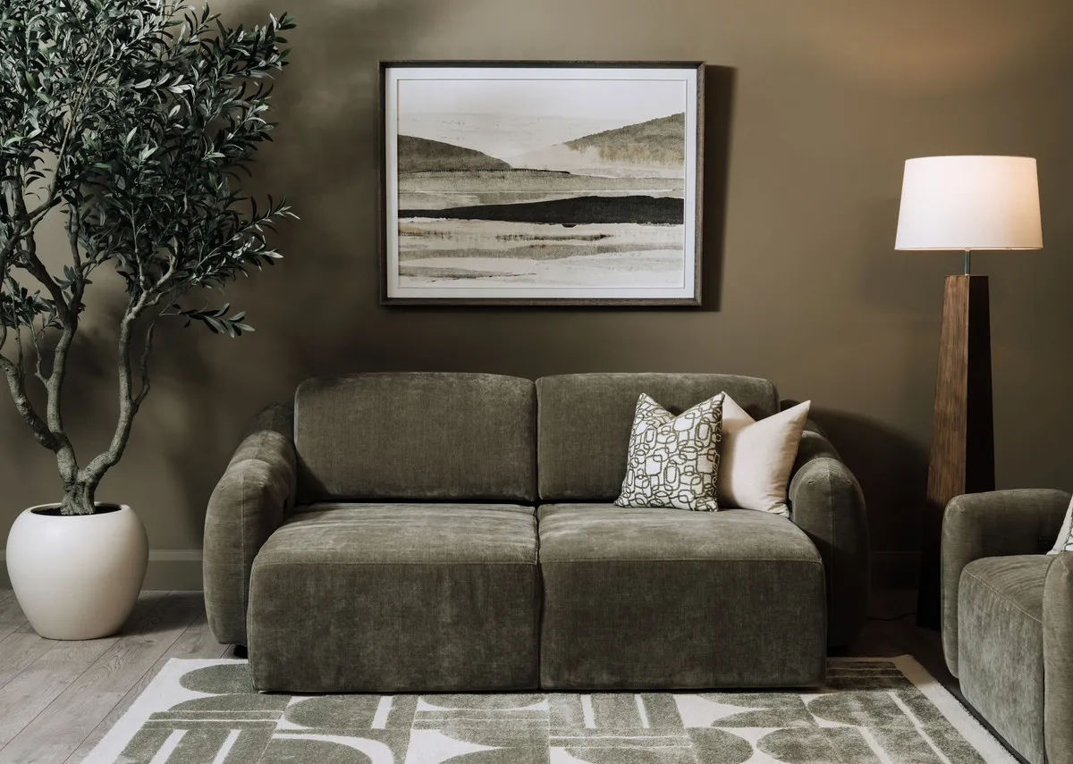 A lifestyle image of the Morning mirage pciture over a white mantle with candle holder.