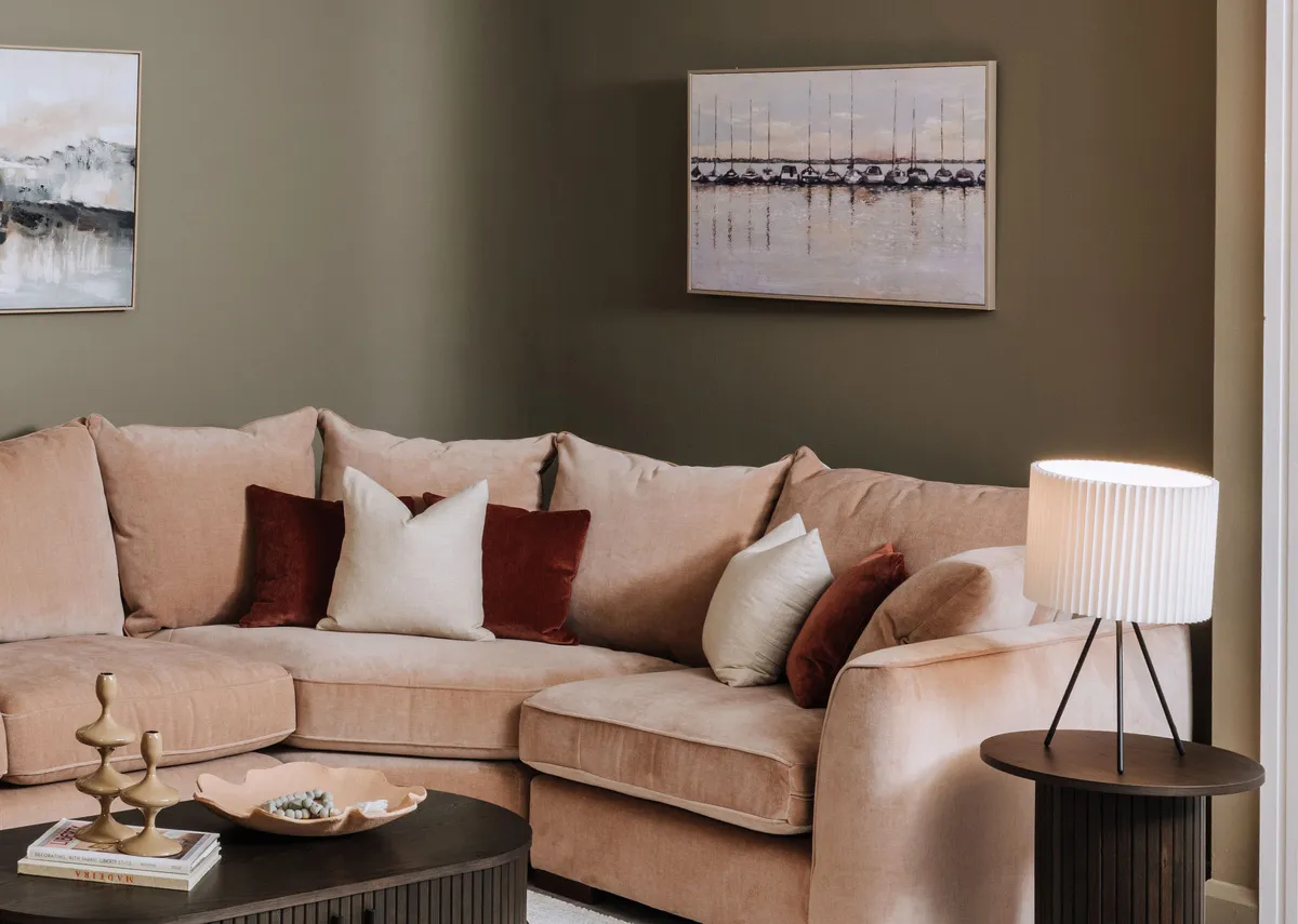 Hand painted in a rich green the Resin woodland tree with lights ornament is a must! Shop the seasonal display this Christmas only at EZ Living Furniture. lifetsyle image of the Dawn at the Marina canvas with Lucius corner sofa