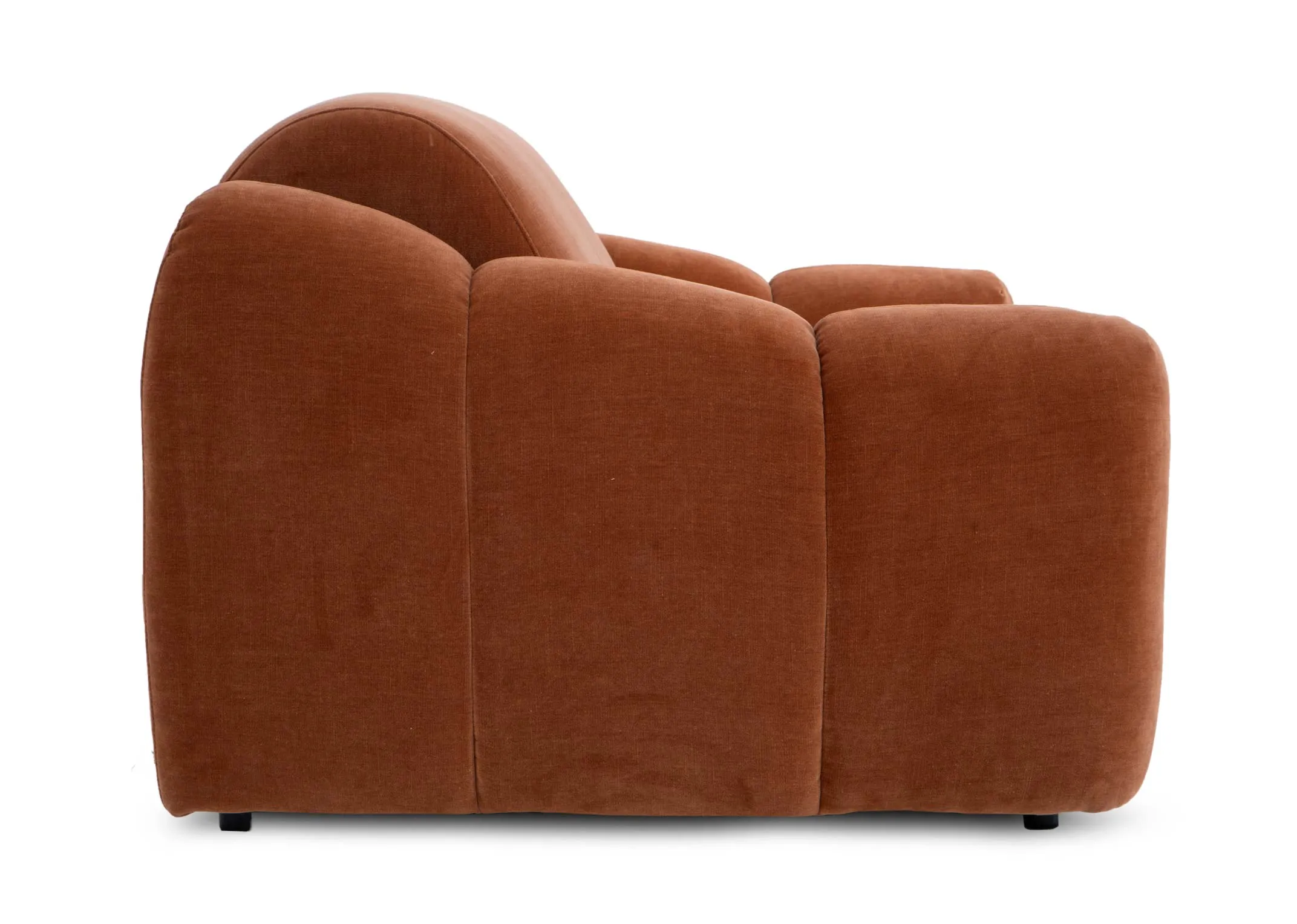 A rust orange armchair from EZ Livings Eleanor range. Side view of tufted detail and stitching.